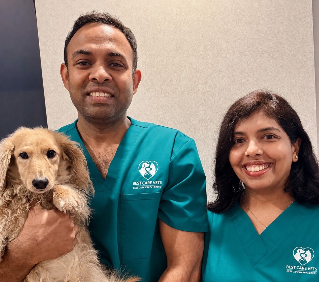 Pamu and Damitha with their dog — Best Care Vets